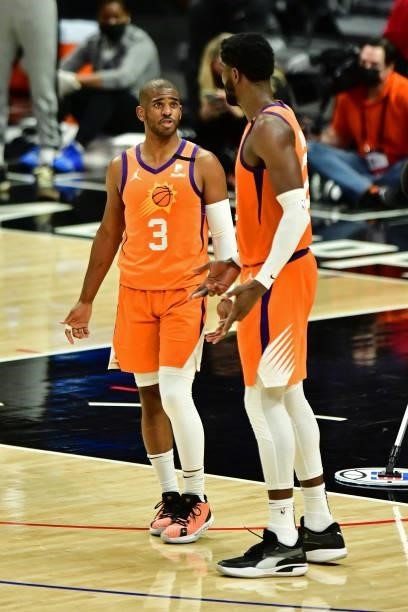 Chris Paul and Deandre Ayton of the Phoenix Suns talk during the game against the LA Clippers during Game 6 of the Western Conference Finals of the...