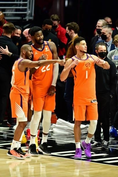 Chris Paul Deandre Ayton and Devin Booker of the Phoenix Suns look on after the game against the LA Clippers during Game 6 of the Western Conference...