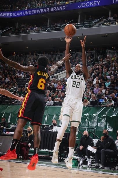 Khris Middleton of the Milwaukee Bucks shoots a three point basket against the Atlanta Hawks during Game 5 of the Eastern Conference Finals of the...