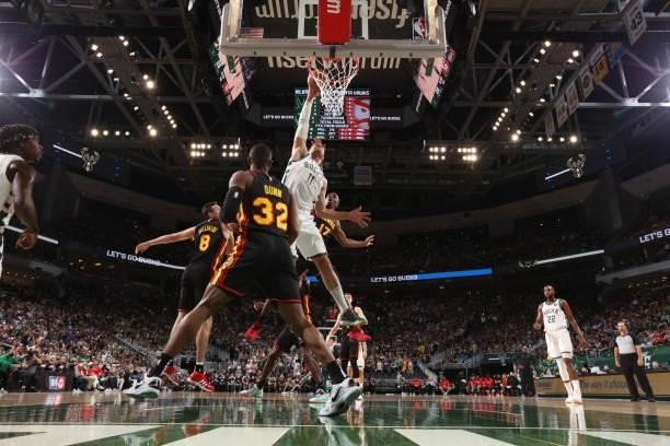 Brook Lopez of the Milwaukee Bucks drives to the basket against the Atlanta Hawks during Game 5 of the Eastern Conference Finals of the 2021 NBA...