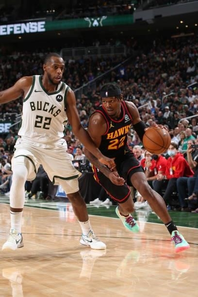 Khris Middleton of the Milwaukee Bucks plays defense on Cam Reddish of the Atlanta Hawks during Game 5 of the Eastern Conference Finals of the 2021...
