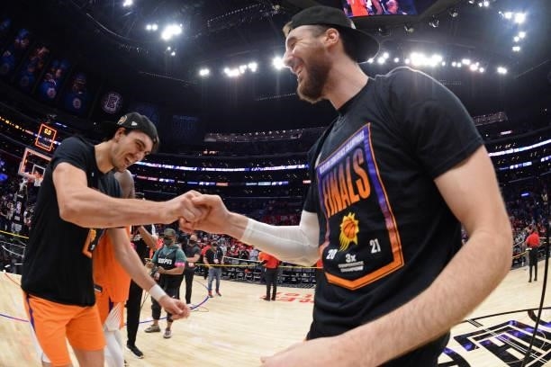 Dario Saric of the Phoenix Suns fist bumps Frank Kaminsky of the Phoenix Suns after the game against the LA Clippers during Game 6 of the Western...