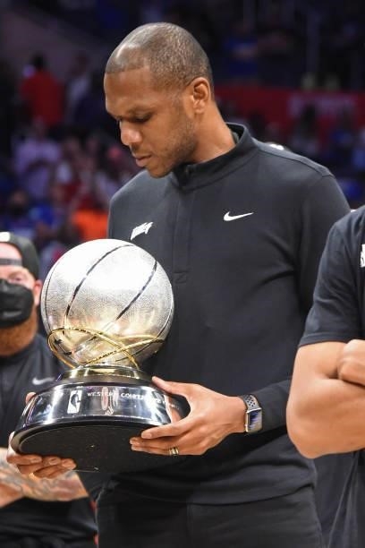 General Manager, James Jones of the Phoenix Suns holds the Western Conference Finals Trophy after the game against the LA Clippers during Game 6 of...