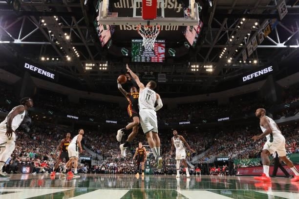 Brook Lopez of the Milwaukee Bucks blocks the ball against the Atlanta Hawks during Game 5 of the Eastern Conference Finals of the 2021 NBA Playoffs...