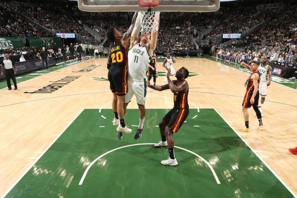 Brook Lopez of the Milwaukee Bucks dunks the ball against the Atlanta Hawks during Game 5 of the Eastern Conference Finals of the 2021 NBA Playoffs...