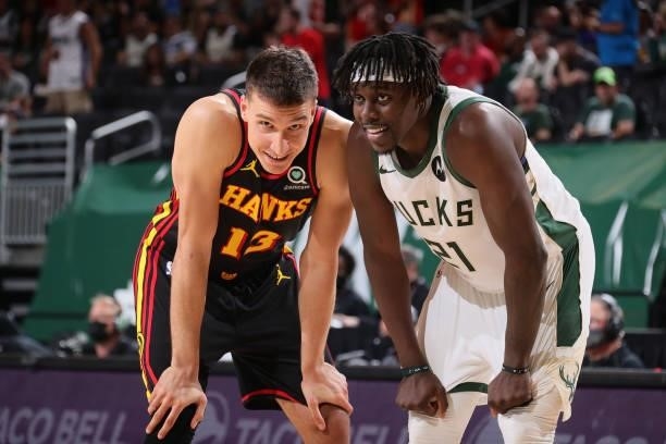 Bogdan Bogdanovic of the Atlanta Hawks and Jrue Holiday of the Milwaukee Bucks look on during Game 5 of the Eastern Conference Finals of the 2021 NBA...