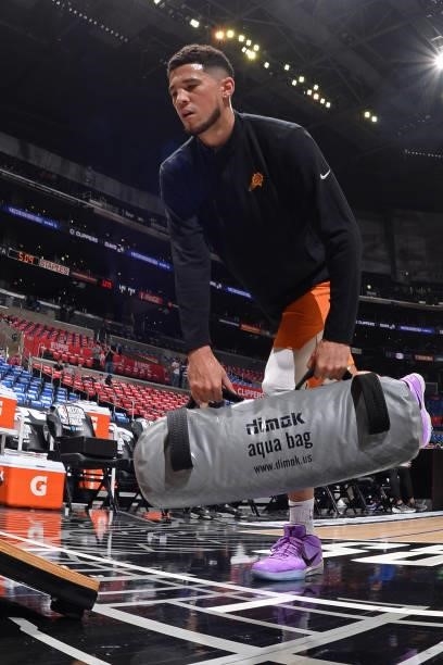 Devin Booker of the Phoenix Suns lifts weights before the game during Game 6 of the Western Conference Finals of the 2021 NBA Playoffs on June 30,...