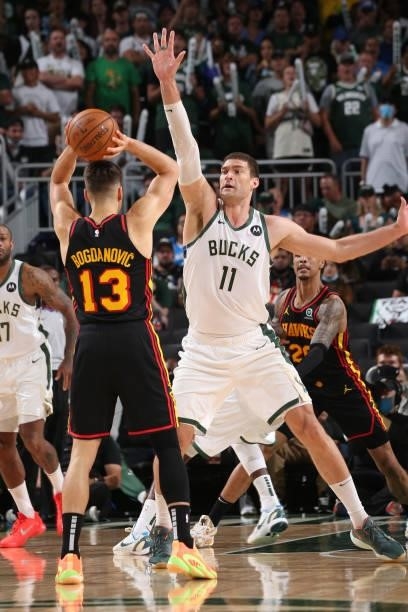 Brook Lopez of the Milwaukee Bucks plays defense on Bogdan Bogdanovic of the Atlanta Hawks during Game 5 of the Eastern Conference Finals of the 2021...