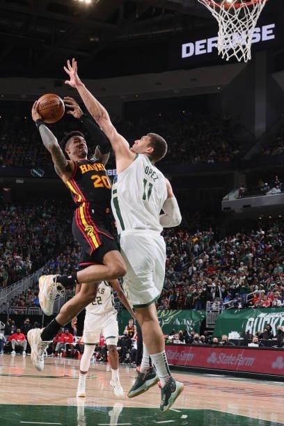 John Collins of the Atlanta Hawks drives to the basket against the Milwaukee Bucks during Game 5 of the Eastern Conference Finals of the 2021 NBA...