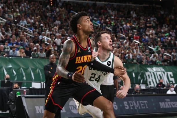 John Collins of the Atlanta Hawks and Pat Connaughton of the Milwaukee Bucks fight for position during Game 5 of the Eastern Conference Finals of the...