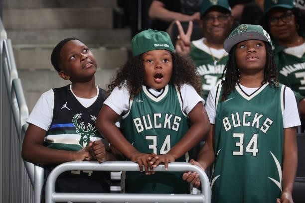 Milwaukee Bucks fans look on during Game 5 of the Eastern Conference Finals of the 2021 NBA Playoffs on July 1, 2021 at the Fiserv Forum Center in...