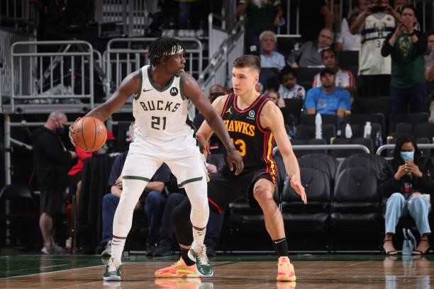 Bogdan Bogdanovic of the Atlanta Hawks plays defense on Jrue Holiday of the Milwaukee Bucks during Game 5 of the Eastern Conference Finals of the...
