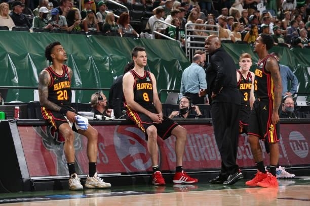 Head Coach Nate McMillan of the Atlanta Hawks talks with John Collins and Danilo Gallinari during Game 5 of the Eastern Conference Finals of the 2021...