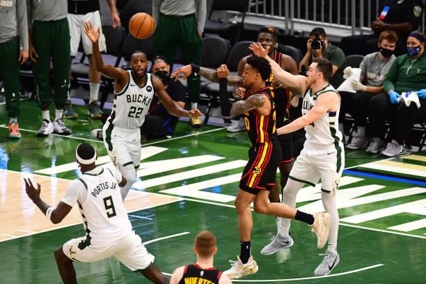 John Collins of the Atlanta Hawks passes the ball during the game against the Milwaukee Bucks during Game 5 of the Eastern Conference Finals of the...