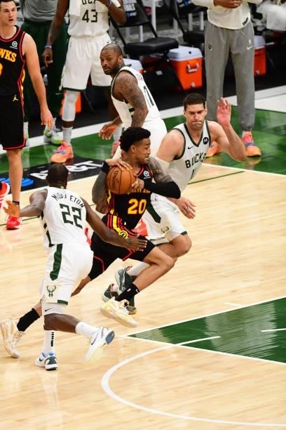 John Collins of the Atlanta Hawks drives to the basket during the game against the Milwaukee Bucks during Game 5 of the Eastern Conference Finals of...