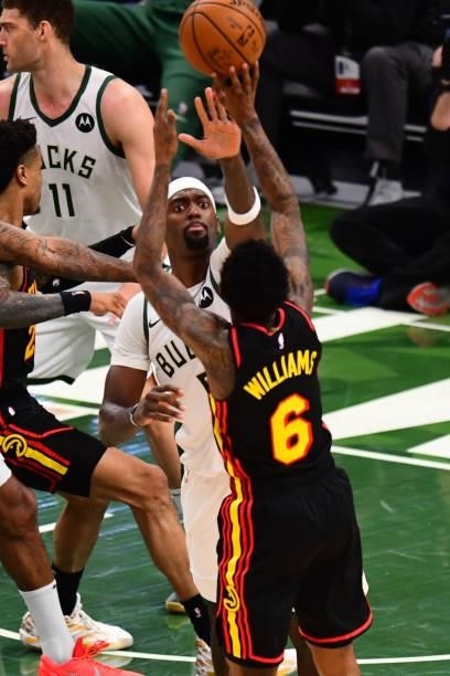 Bobby Portis of the Milwaukee Bucks attempts to block a shot by Lou Williams of the Atlanta Hawks during Game 5 of the Eastern Conference Finals of...