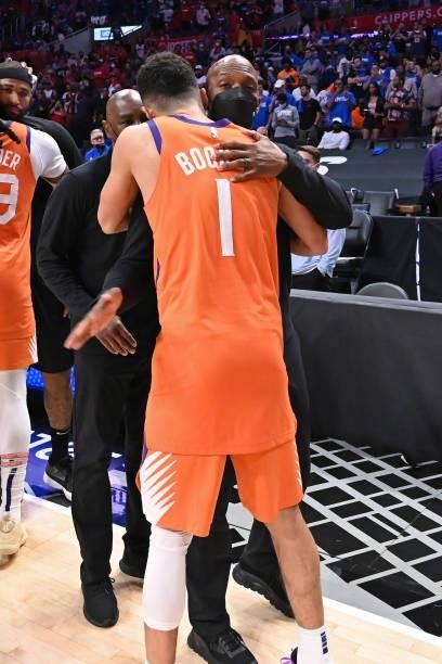Assistant Coach, Chauncey Billups of the LA Clippers hugs Devin Booker of the Phoenix Suns after the game during Game 6 of the Western Conference...