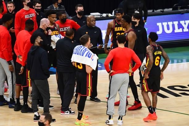 Head Coach Nate McMillan of the Atlanta Hawks talks to players during the game against the Milwaukee Bucks during Game 5 of the Eastern Conference...