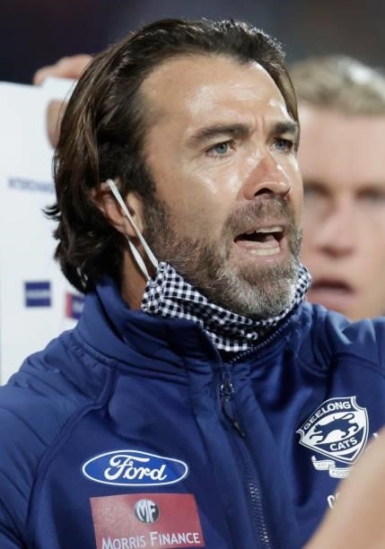 Chris Scott, Senior Coach of the Cats addresses his players during the 2021 AFL Round 16 match between the Geelong Cats and the Essendon Bombers at...