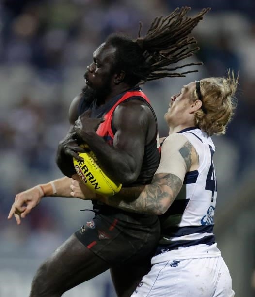 Anthony McDonald-Tipungwuti of the Bombers and Tom Stewart of the Cats in action during the 2021 AFL Round 16 match between the Geelong Cats and the...