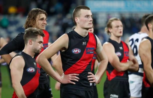 Nikolas Cox of the Bombers looks dejected after a loss during the 2021 AFL Round 16 match between the Geelong Cats and the Essendon Bombers at GMHBA...
