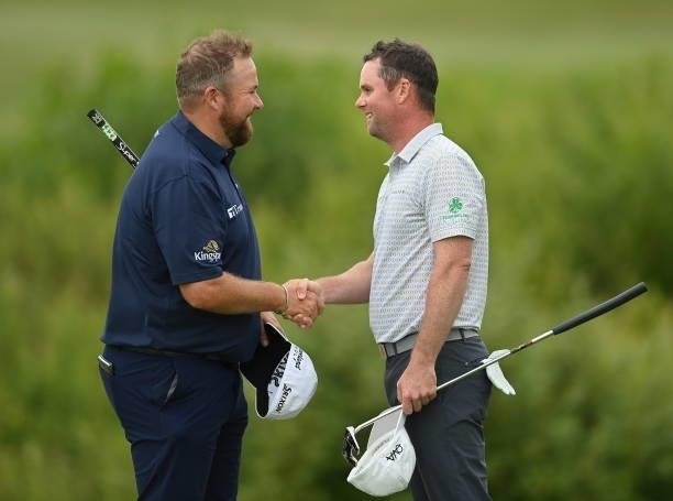 Kilkenny , Ireland - 2 July 2021; Shane Lowry of Ireland, left, and Jonathan Caldwell of Northern Ireland shake hands after their round on day two of...