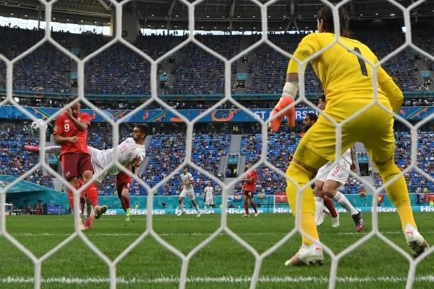 Spain's midfielder Ferran Torres shoots to the goal during the UEFA EURO 2020 quarter-final football match between Switzerland and Spain at the Saint...