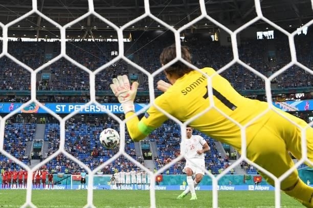 Switzerland's goalkeeper Yann Sommer stops for the ball hit by Spain's midfielder Rodri during penalty shoot-outs at the end of the UEFA EURO 2020...