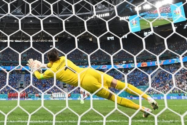 Switzerland's goalkeeper Yann Sommer stops for the ball hit by Spain's midfielder Rodri during penalty shoot-outs at the end of the UEFA EURO 2020...