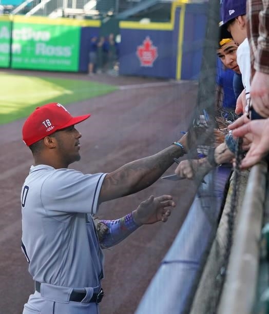 Wander Franco of the Tampa Bay Rays signs autographs before the game against the Toronto Blue Jays at Sahlen Field on July 2, 2021 in Buffalo, New...