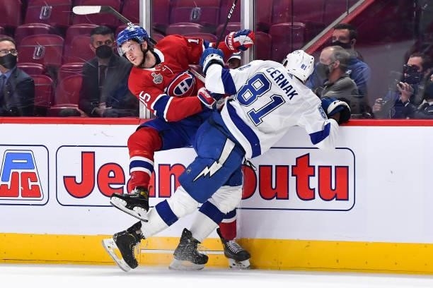 Erik Cernak of the Tampa Bay Lightning checks Jesperi Kotkaniemi of the Montreal Canadiens in Game Three of the Stanley Cup Final of the 2021 Stanley...