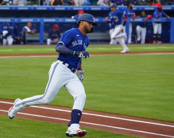 Lourdes Gurriel Jr. #13 of the Toronto Blue Jays hits a one run double during the second inning against the Tampa Bay Rays at Sahlen Field on July 2,...