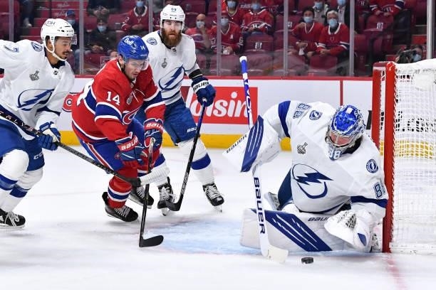 Goalie Andrei Vasilevskiy of the Tampa Bay Lightning makes a save on a shot by Nick Suzuki of the Montreal Canadiens in Game Three of the Stanley Cup...