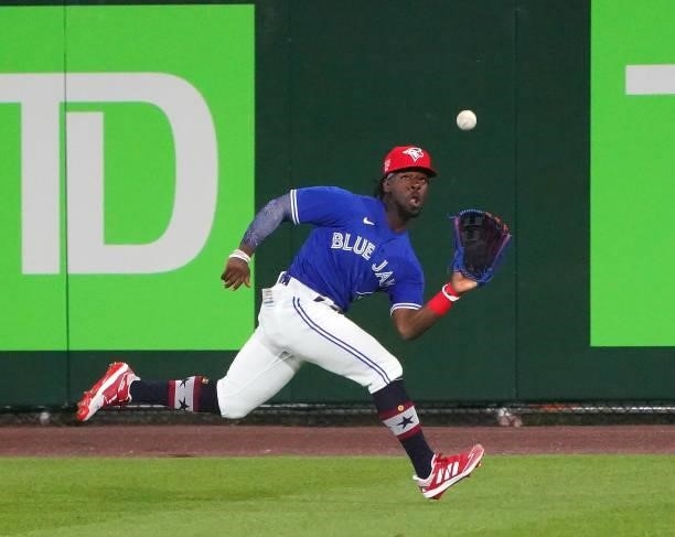 Jonathan Davis of the Toronto Blue Jays makes a catch in center field on a ball hit by Randy Arozarena of the Tampa Bay Rays during the ninth inning...