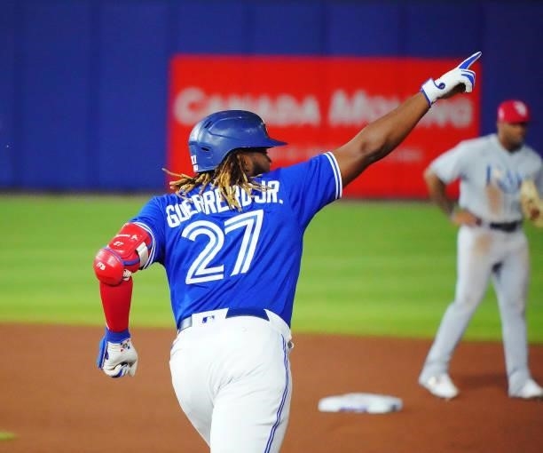 Vladimir Guerrero Jr. #27 of the Toronto Blue Jays celebrates after hitting a two-run home run during the seventh inning against the Tampa Bay Rays...