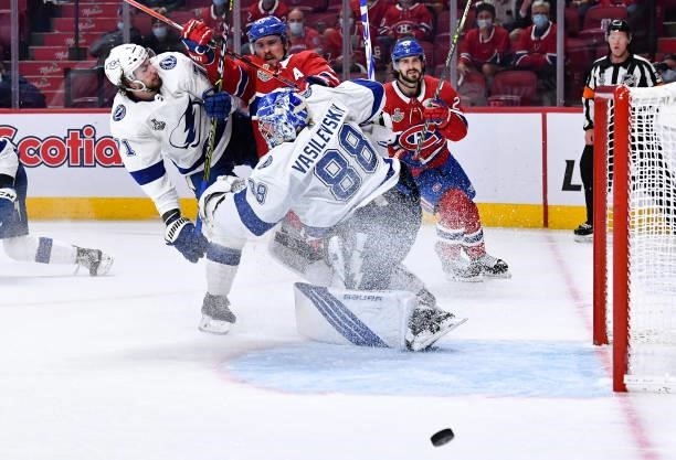 Goalie Andrei Vasilevskiy and Anthony Cirelli of the Tampa Bay Lightning defend the goal against Brendan Gallagher of the Montreal Canadiens in Game...