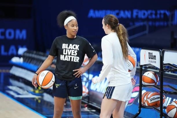 Marina Mabrey of the Dallas Wings talks with teammate Tyasha Harris before the game against the Chicago Sky on July 2, 2021 at the College Park...