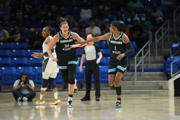 Stefanie Dolson of the Chicago Sky high fives teammate Diamond DeShields during the game against the Dallas Wings on July 2, 2021 at the College Park...