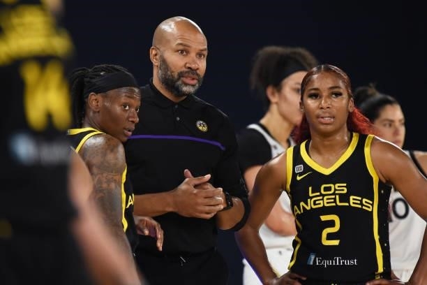 Erica Wheeler of the Los Angeles Sparks, head coach Jeff Fisher and Te'a Cooper of the Los Angeles Sparks looks on during the game against the Las...