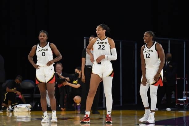 Jackie Young of the Las Vegas Aces, A'ja Wilson of the Las Vegas Aces and Chelsea Gray of the Las Vegas Aces smile during the game against the Los...