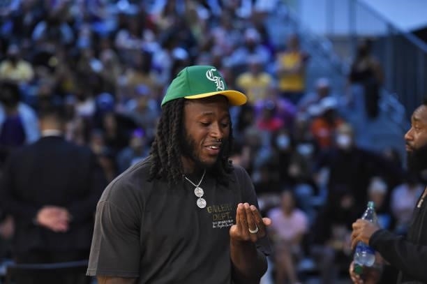 New Orleans Saints running back Alvin Kamara smiles during the Las Vegas Aces vs. Los Angeles Sparks game on July 2, 2021 at Los Angeles Convention...