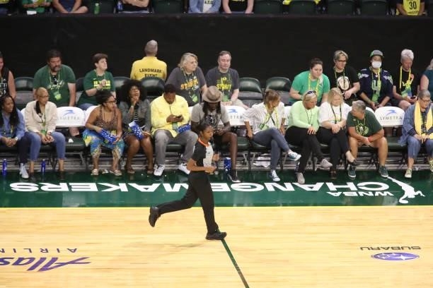 Referee, Danielle Scott runs in front of the Changemakers sign during the game between the Atlanta Dream and the Seattle Storm on July 2, 2021 at the...