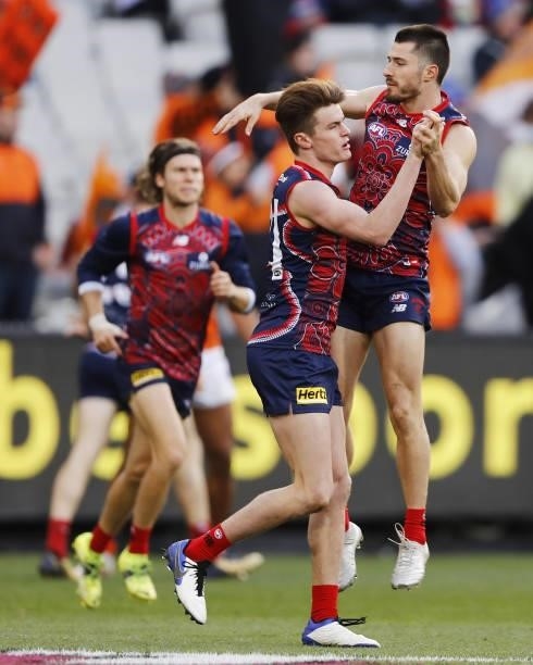 Bayley Fritsch of the Demons celebrates a goal with Alex Neal-Bullen during the 2021 AFL Round 16 match between the Melbourne Demons and the GWS...