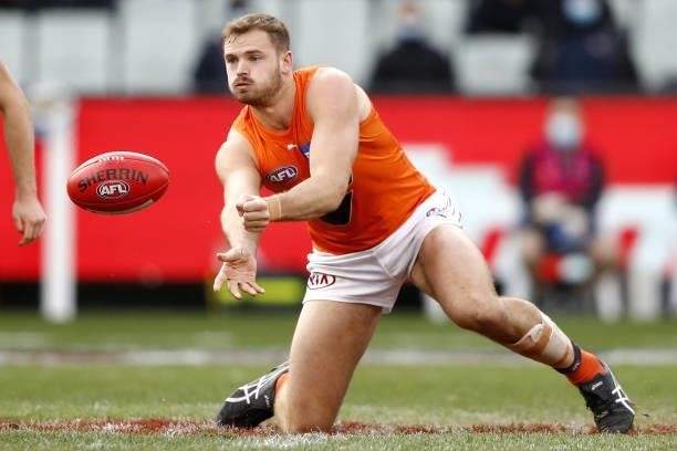 Matt Flynn of the Giants handpasses the ball during the 2021 AFL Round 16 match between the Melbourne Demons and the GWS Giants at the Melbourne...