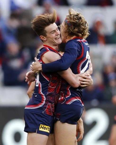 Bayley Fritsch of the Demons celebrates a goal with Jayden Hunt during the 2021 AFL Round 16 match between the Melbourne Demons and the GWS Giants at...