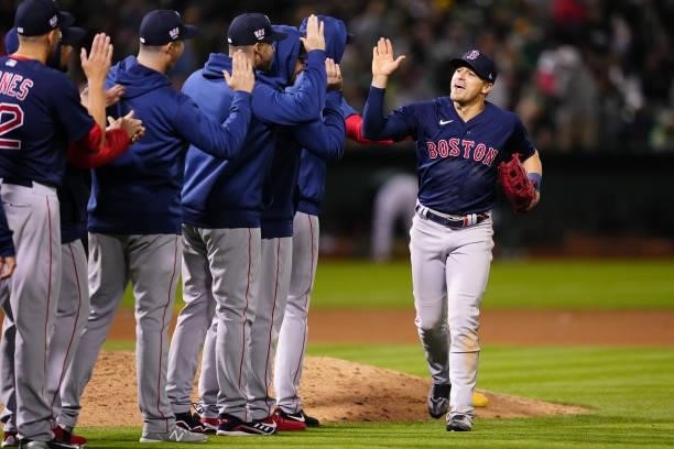 Enrique Hernández of the Boston Red Sox celebrates with teammates after the game between the Boston Red Sox and the Oakland Athletics at Oakland...