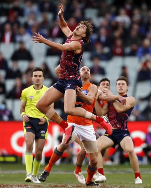 Luke Jackson of the Demons and Shane Mumford of the Giants compete for the ball during the 2021 AFL Round 16 match between the Melbourne Demons and...