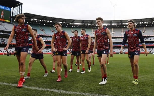 Luke Jackson, Trent Rivers, Bayley Fritsch and Ed Langdon of the Demons leave the field after a loss during the 2021 AFL Round 16 match between the...