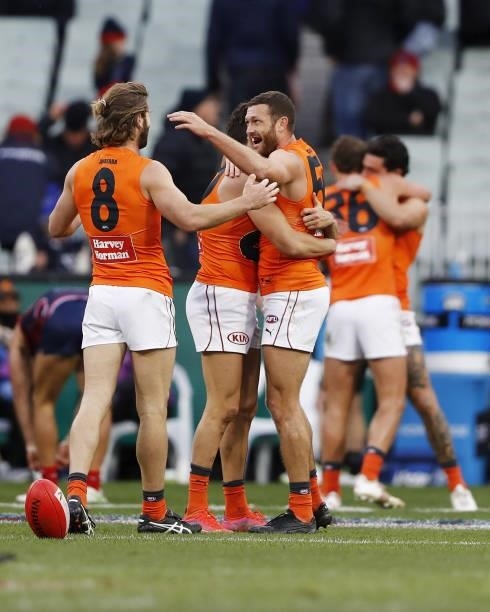 Sam J. Reid of the Giants celebrates with Callan Ward during the 2021 AFL Round 16 match between the Melbourne Demons and the GWS Giants at the...