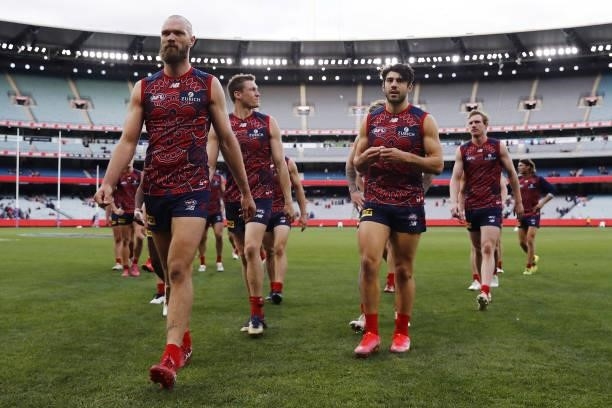 Max Gawn of the Demons leads his team off the ground after a loss during the 2021 AFL Round 16 match between the Melbourne Demons and the GWS Giants...